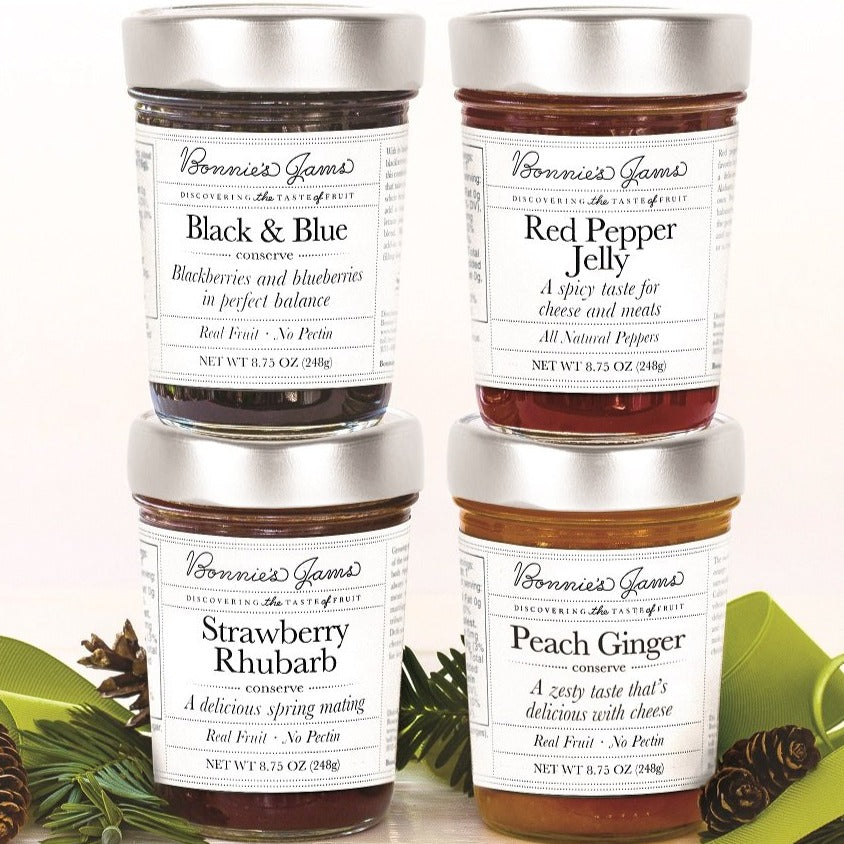 Four jars: Black & Blue, Red Pepper Jelly, Strawberry Rhubarb, and Peach Ginger